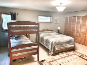 Queen Bed upstairs with bunk