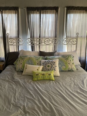 King bed in a secluded master bedroom. 