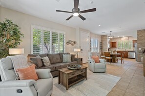 Spacious living room with sofa and two recliners