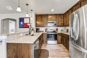 Kitchen with bar seating.