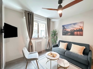 Convertible sofa for additional sleeping space in the stylish studio.
