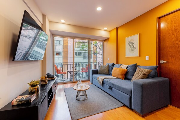 Fully furnished living room with TV.


