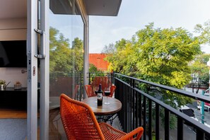 Experience the city from above on your private balcony.
