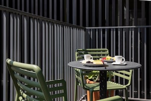 Enjoy stunning views of the city skyline from our private balcony, the perfect spot for a morning coffee or evening cocktail.