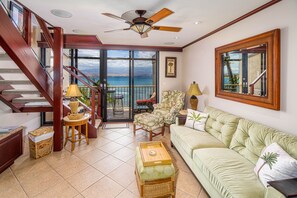 Living room with lanai in the background.  View of Haleakala and the ocean.