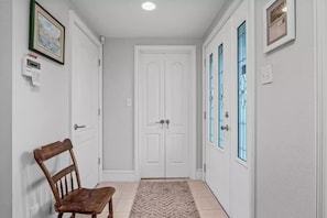 Foyer areas accessed from the front door and the garage.