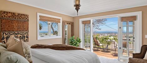 Primary bedroom with city and ocean views