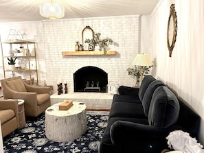 The cozy living room welcomes you to sit, relax and enjoy.