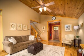 The living room includes a queen sized sleeper sofa. 