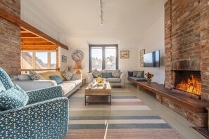 Outside Edge, Burnham Deepdale: Sitting room with open fire