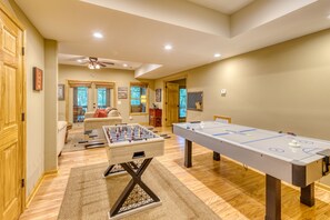 Game room with foosball, air hockey, x-box and board games.