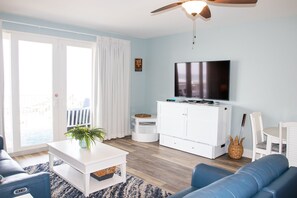 Queen Murphy Bed in living room, child's table, & play area