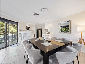 A modern dining area seats six so can enjoy home-cooked meals together.