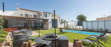 Property building,BBQ facilities,Garden,Pool view,Swimming pool