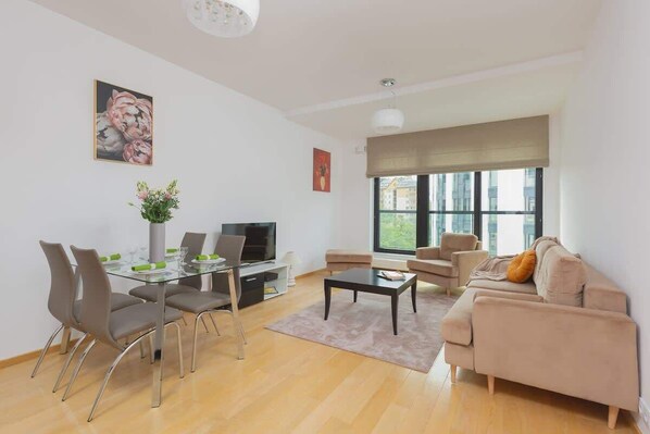 Relax in the stylish living room with a comfortable sofa and modern decor.