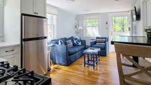 Kitchen room and dining area with living room beyond