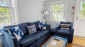 Living room with comfortable seating and flat screen TV