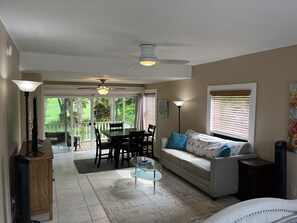 Living Space and Dining Table with views outside to Golf Course and Nature Path