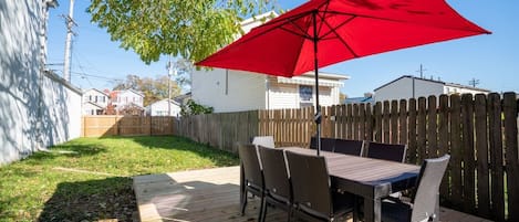 Enjoy a meal on the deck or play games in the massive backyard. There's plenty of room to get a game of Cornhole going.