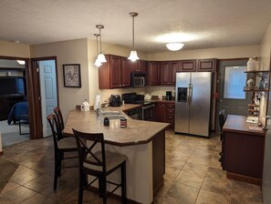 kitchen area with breakfast bar seating 