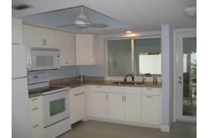 Fully equipped Kitchen, with pots/pans, essential cooking utensils, basic spices