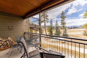 Private balcony offering a gas grill, seating and mountain views.