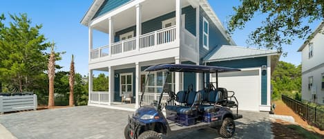 Exterior of home with golf cart