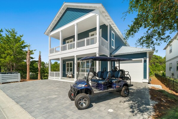 Exterior of home with golf cart