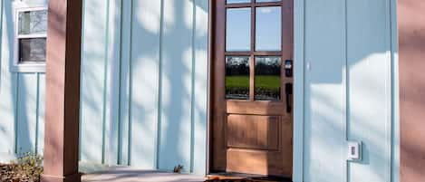 The front door has an electronic entry lock and security camera for your safety.