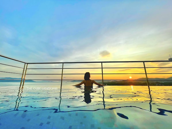 Rooftop Swimming Pool with Sunset View