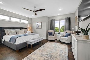 Our Master bedroom is complete with a King-size bed, closets, dresser, 55-inch Sony Smart Roku TV, seating area, remote control window shades and a stunning en suite bathroom.