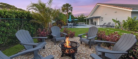 Fire pit makes evenings a pleasure in this large, private yard.