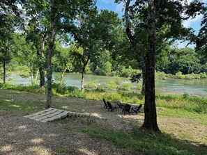 Step straight into nature—relax riverside with a private fire pit and direct access to the Glover River.