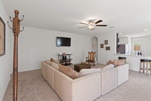 Comfy seating, a smart TV, and room for everyone—ideal for relaxing together.