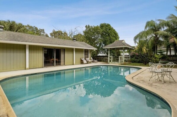 heating pool with gazebo and beautiful garden