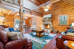 Cozy up by the stone fireplace—perfect for chilly evenings.