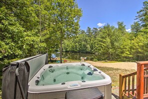 Hot Tub Oasis: Unwind in the bubbling retreat while soaking in stunning lakeside views!