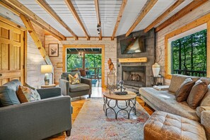 Living room with gas fireplace and Smart TV