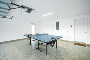 Spacious game room featuring a high-quality Joola ping pong table – perfect for some friendly competition.