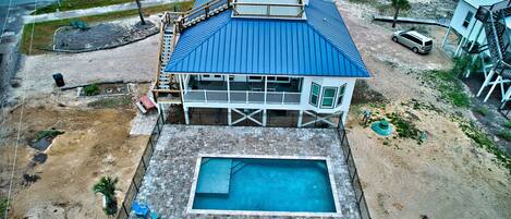 New  pool and paver area, on Gulf side of the home. 100 yards from beach.