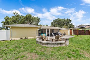 Gather around in the backyard around the stone fire put area in the evenings!