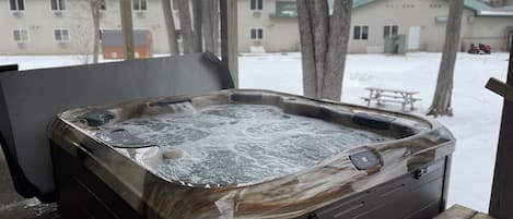 Brand new hot tub with covered deck above