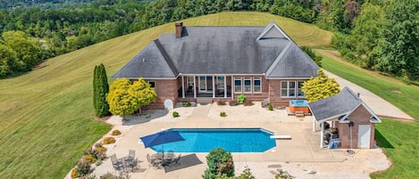 Get ready to be “wowed” by this 4,500+ sq. ft. spectacular modern, brick, Colonial-style retreat estate with soaring vistas.