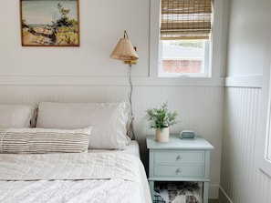 First floor bedroom - king sized bed with fresh white bedding and extra pillows