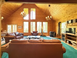 Spacious living room with fireplace for you to cozy up after a long day.