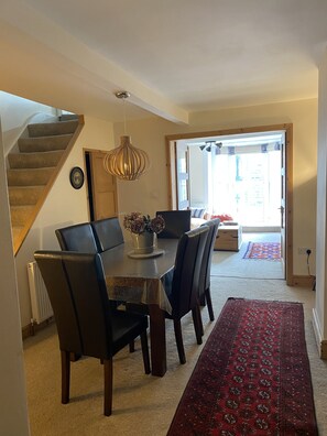 Dining room through to living room with stairs up to second floor