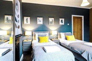 Cosy Bedroom No. 1 has a SuperKing bed but can also be arranged as Twin Singles with stylish decor and bed tables and accent lighting. 
