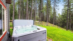 Private luxury hot tub on the lower level patio of the home.