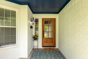 Front door with semi private glass allows for light to shine through