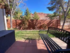 Outdoor patio with greenspace.